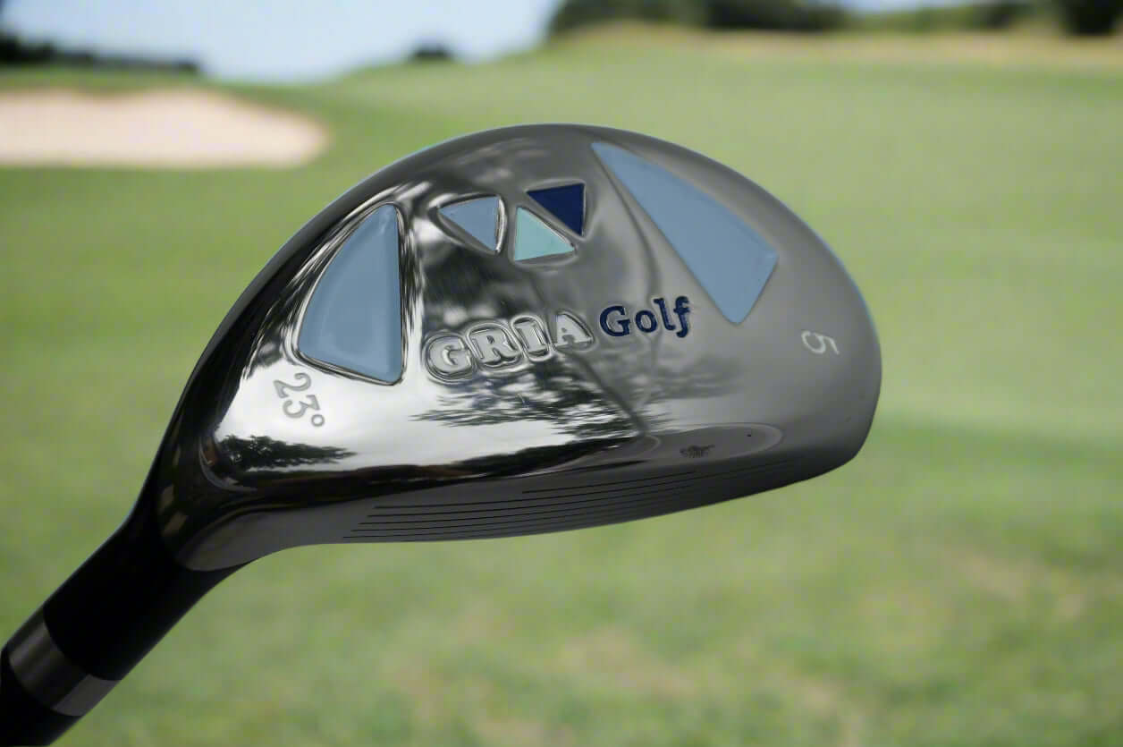 Close-up of a golf club head with 'Gria Golf' branding on a gray background
